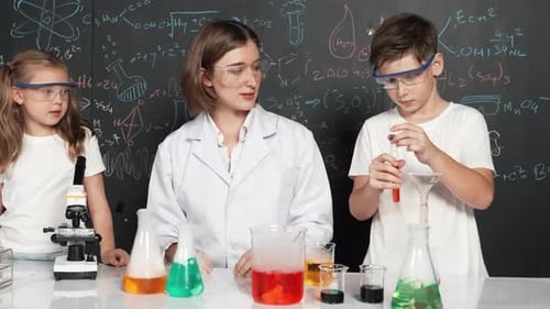 Teacher and Students in Chemistry Lab Doing Experiment