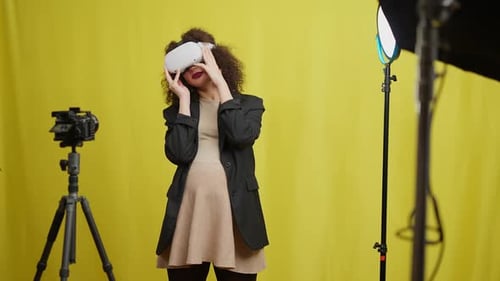 Woman in Studio Wearing a VR Headset