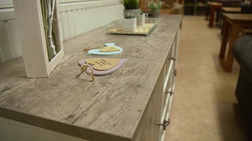 Wooden dresser with beautiful decoration on top inside furniture store.