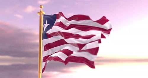 Realistic Liberia National Flag Waving Against a Cloudy Sky