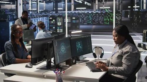 Data Center System Administrator Using PC to Monitor Neural Networks