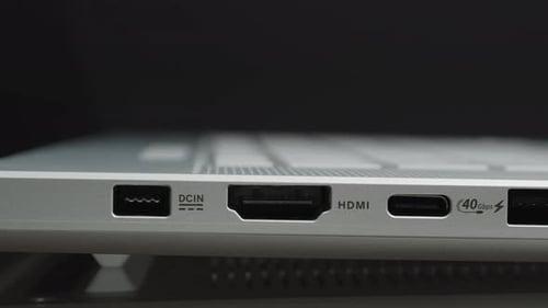 Slider Shot of a Laptop’s Side Panel Showcasing DCIN, HDMI, USB-C, USB-A, and Headphone Jack Ports
