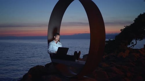 Enjoy Creative Remote Work By the Serene Ocean at Dusk Embracing an Inspiring Lifestyle