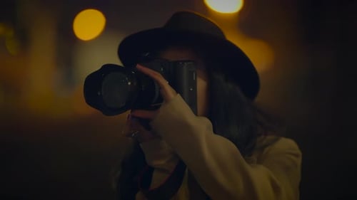 Stylish Woman with Camera at Night