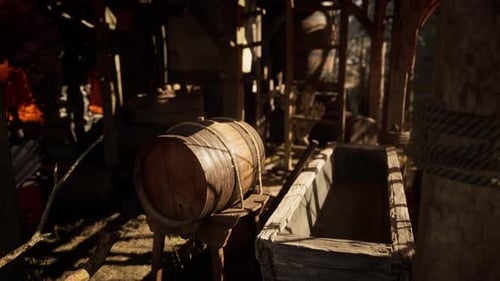Wooden Barrel and Container in a Rustic Workshop During Daylight Hours