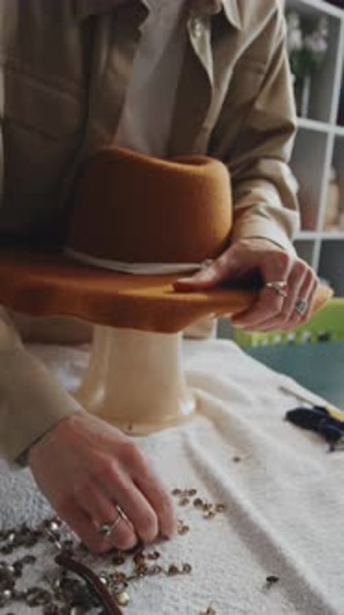 Hatter Putting Thumbtacks on New Wool Hat