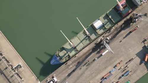 Cargo Ship Moored At Port Terminal