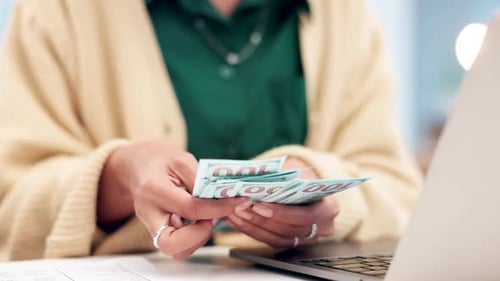 Hands, accountant woman and cash at desk, counting and budget for savings