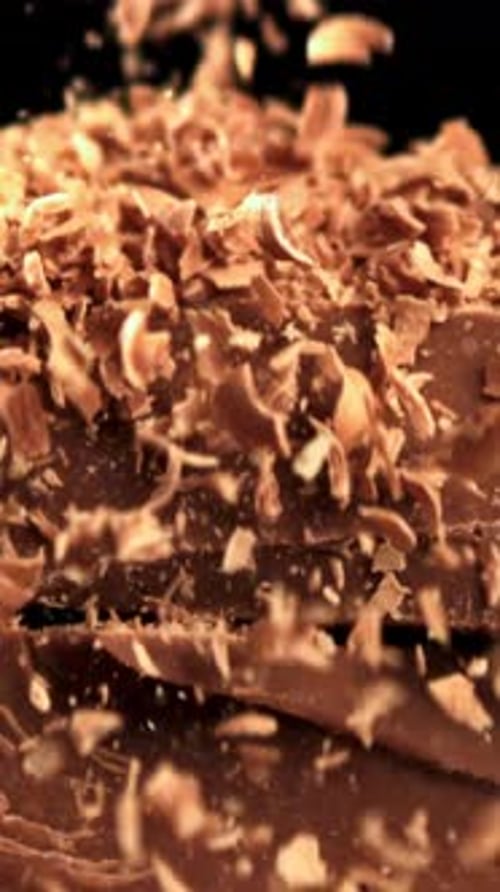 The Grated Chocolate Falls on the Chocolate Slices Filmed on a Highspeed Camera at 1000 Fps
