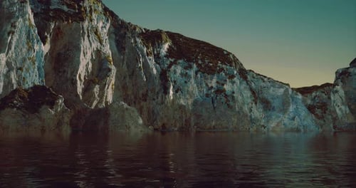 Cinematic Ocean Voyage Past Majestic Cliffs at Sunset