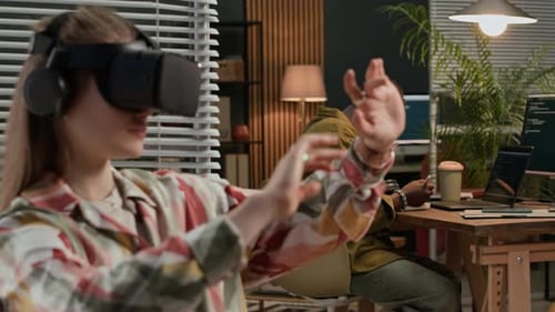 Woman Uses VR Headset in Modern Office