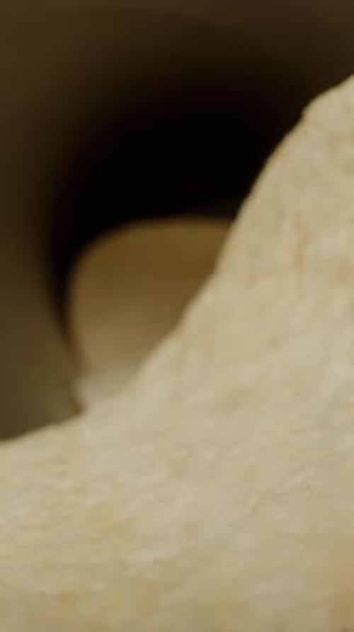 Vertical video. POV point of view, taking chips from the can, macro slider shot.