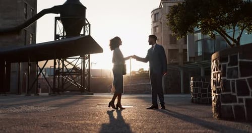 Business People Handshake at Sunset in the City