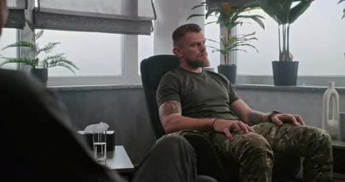 Military Man with Post Traumatic Stress Disorder During Therapy Session