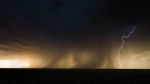 Spectacular Bolts of Lightning Strike from A Scary Storm Base with Beautiful Sky.