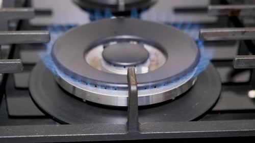 Closeup of a Burning Gas Burner in a Dark Room