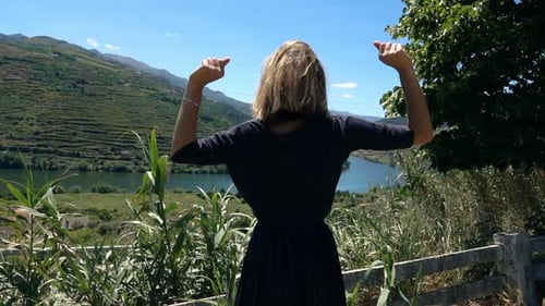 Happy Woman Raising Arms with Victory on Hill in Country, Super Slow