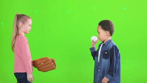 Two Focused Multiracial Kids Playing Baseball in Studio