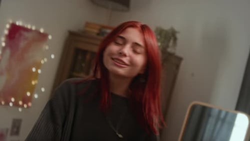 Two People Indoors in Room with Wall Decor