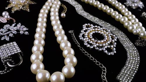 Pearl and Diamond Jewelry on Black Background