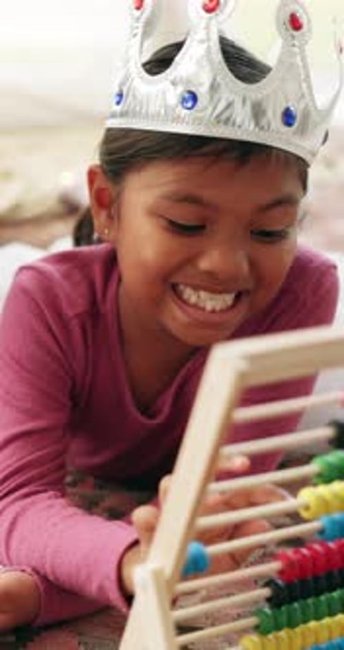 Learning, growth and girl in house with abacus, math practice or fun activity in literacy skills