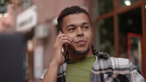A Casual Conversation Taking Place in a Lively Cafe While Using a Mobile Phone to Connect