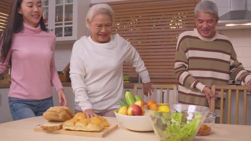 Family Prepares Food Together in Bright Kitchen