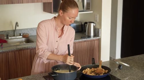 Woman Cooking at Home in Bright Kitchen