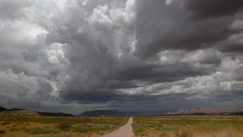 Monsoon Storm Over Dirt Road Wide Shot