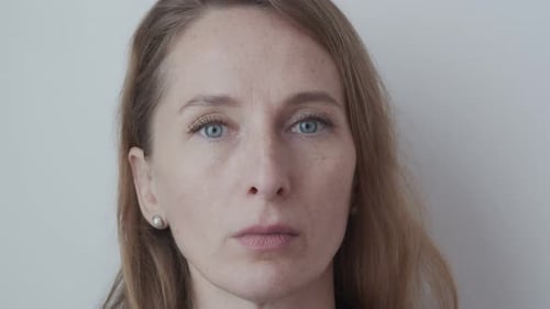 Close Up of Woman Blinking and Smiling