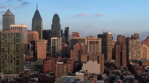 Modern metropolis at sunset, tall skyscrapers dominating the skyline, aerial view of urban architect