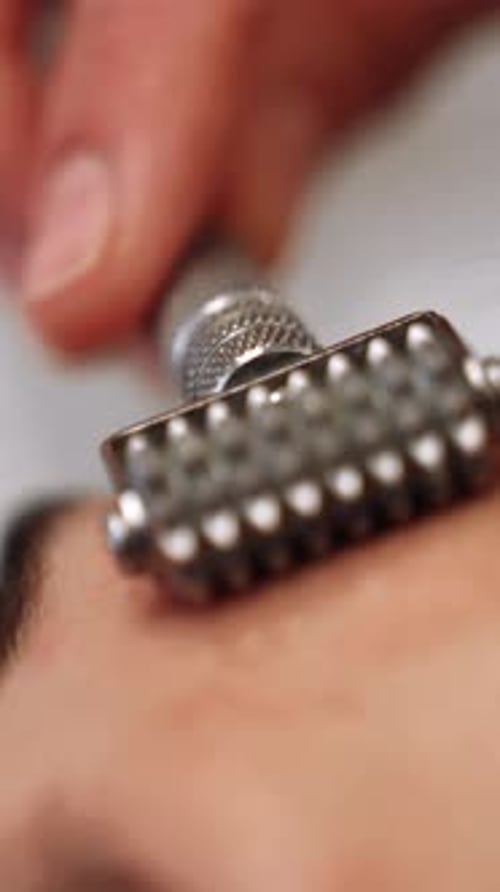 Spiked Roller Massaging Forehead in Close Up