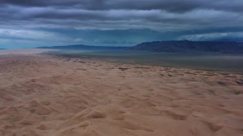 Sand Dunes with Storm Clouds in Gobi Desert