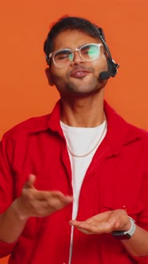 Indian Man Freelance Worker in Headset Call Center Support Service Operator Helpline Having Talk