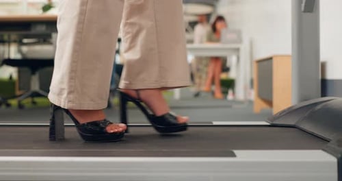 Feet, walking and treadmill with a business woman in the breakroom of her office for exercise