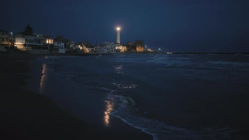 Lighthouse Tower Flashes at Night
