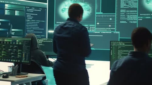 People Working on Computers in High Tech Office