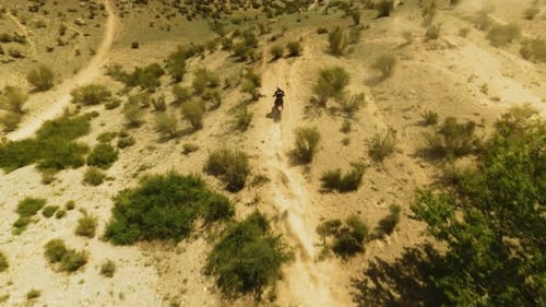 Sportsman Rides Fast Motorbike in Dusty Valley Fpv Drone