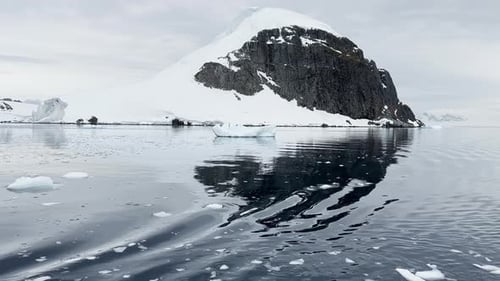A Huge High Breakaway Glacier is Passing By in the Southern Ocean Off the Coast of Antarctica the