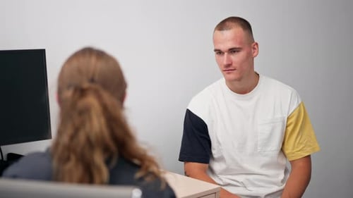 Close Up in a Modern Clinic in a Small Therapist s Office a Young Girl Doctor with a Stethoscope