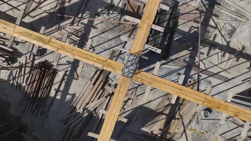 Aerial View Construction Site in Full Motion Workers and Machinery Building Structures
