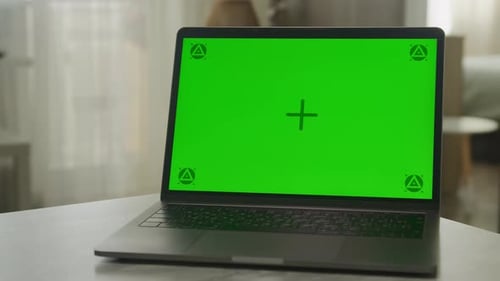 Laptop Reveal with Green Screen on Table
