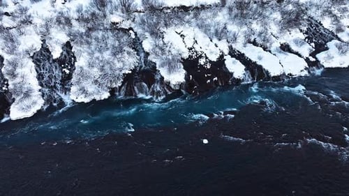 River in Iceland Snowy Hills and Waterfalls in Winter Magical Blue Glacial Water with a Huge Current