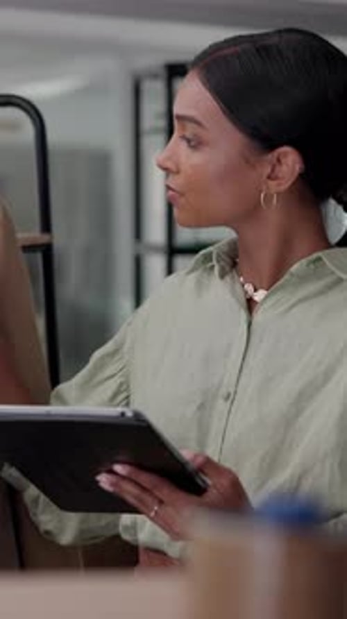 Young Woman Using Tablet in Office Setting