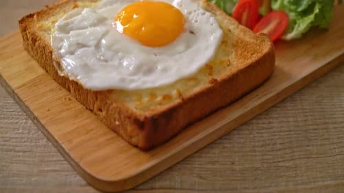 Delicious Sunny-Side Up Egg on Toast with Salad
