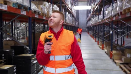 Warehouse Worker Scanning Barcodes on High Shelves