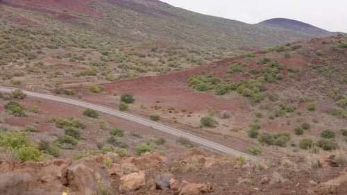 4K Slow Motion Of Red Rocky Valley Landscape And Vegetation From Mauna Kea Lookout, Hawaii