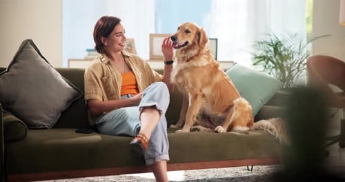 Woman and Dog Sit on Couch, Hugging