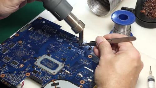 70. When repairing the motherboard, the chip is unsoldered. Repair and maintenance of computers.