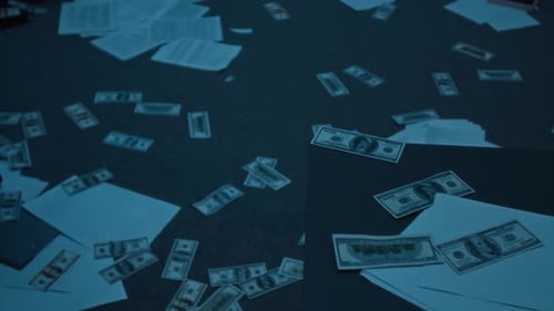 Scattered Money and Documents Lit by Flashlight